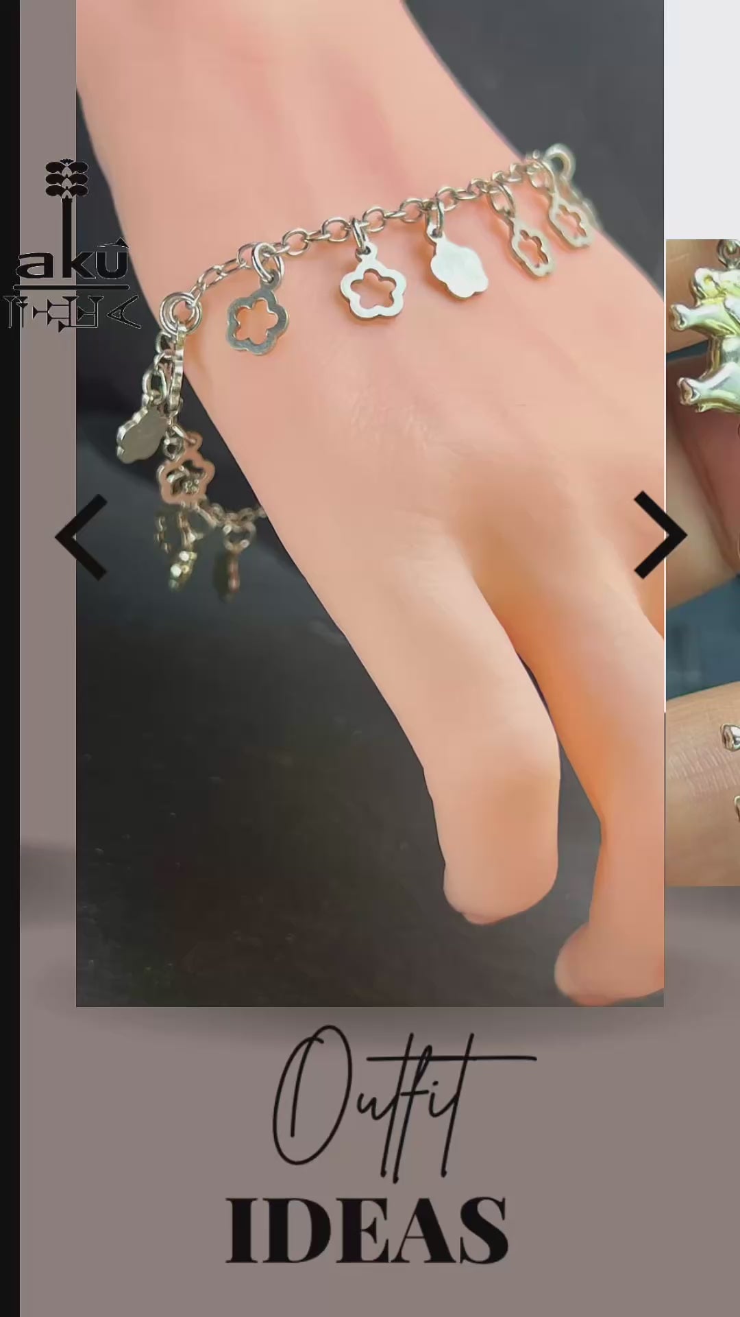 Nahaufnahme eines Vintage-Armbands aus Silber mit Blümchen-Anhängern, filigraner Kette und Design aus den 1980er Jahren.