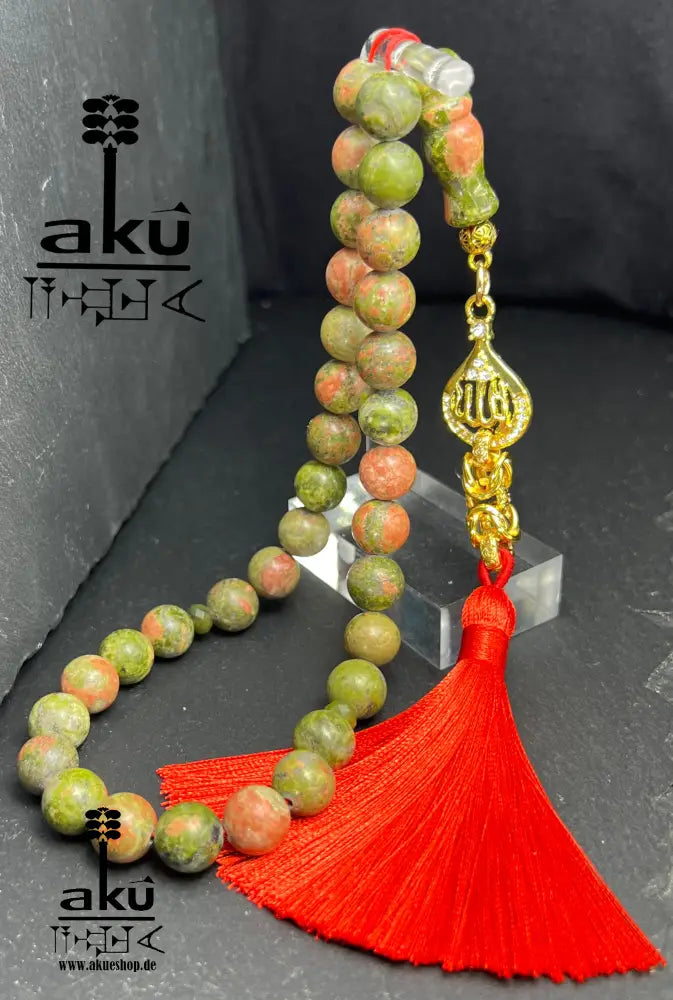 Unakit-Tasbih – 33 Perlen aus natürlichem Stein (10 mm) mit goldbeschichtetem 'Allah'-Anhänger. Perfekt für spirituelle Energie, Meditation oder als elegantes Geschenk für besondere Anlässe