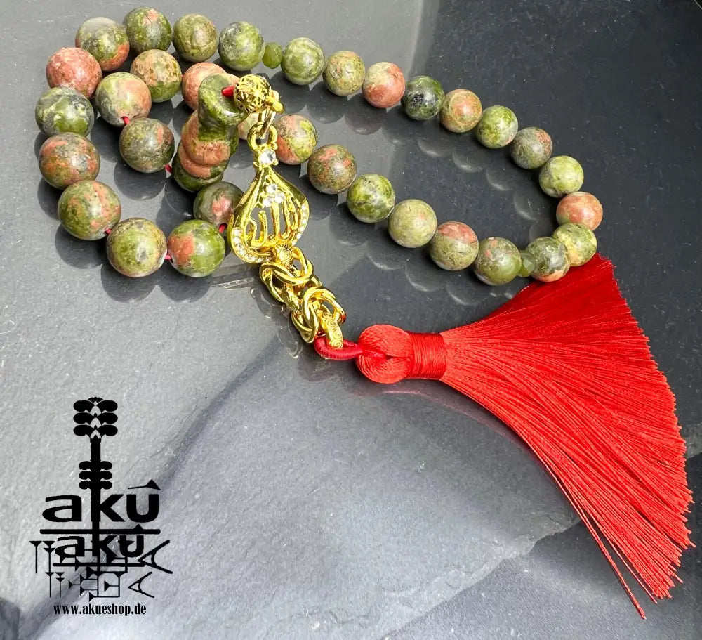 Unakit-Tasbih – 33 Perlen aus natürlichem Stein (10 mm) mit goldbeschichtetem 'Allah'-Anhänger. Perfekt für spirituelle Energie, Meditation oder als elegantes Geschenk für besondere Anlässe