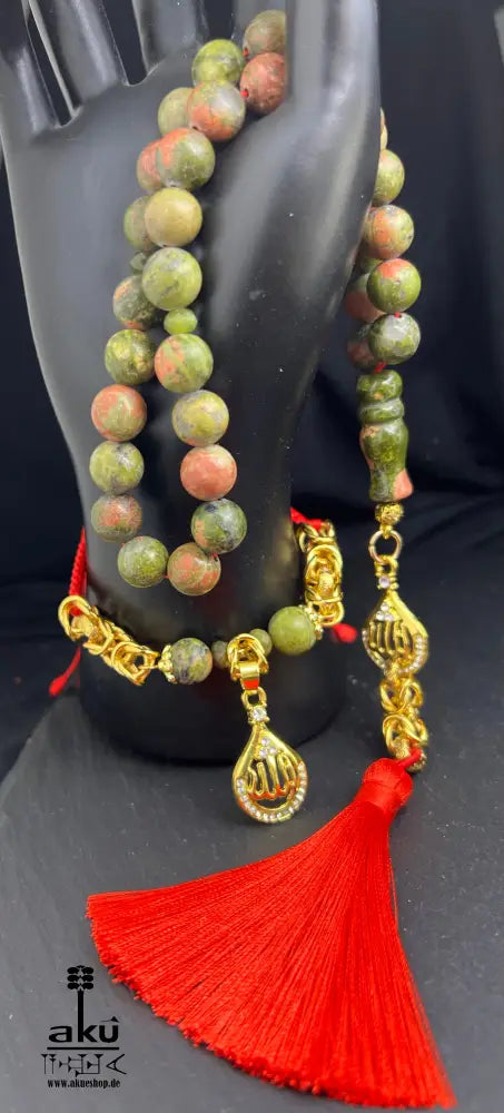 Unakit Tasbih und Armband aus natürlichem Stein (10 mm) mit goldbeschichtetem 'Allah'-Anhänger. Perfekt für spirituelle Energie, Meditation oder als elegantes Geschenk für besondere Anlässe