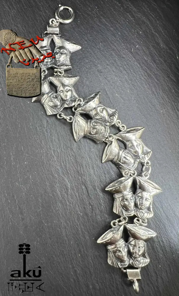 Vintage Ecuadorian 835 silver bracelet with sculpted festival faces – oxidized ethnic silver